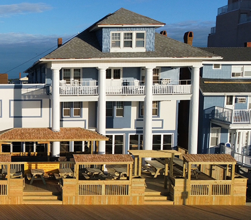 a large white building with many balconies on top of it