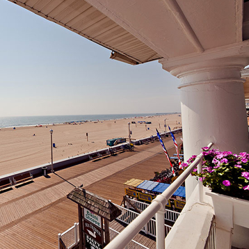 a view of the beach from a balcony